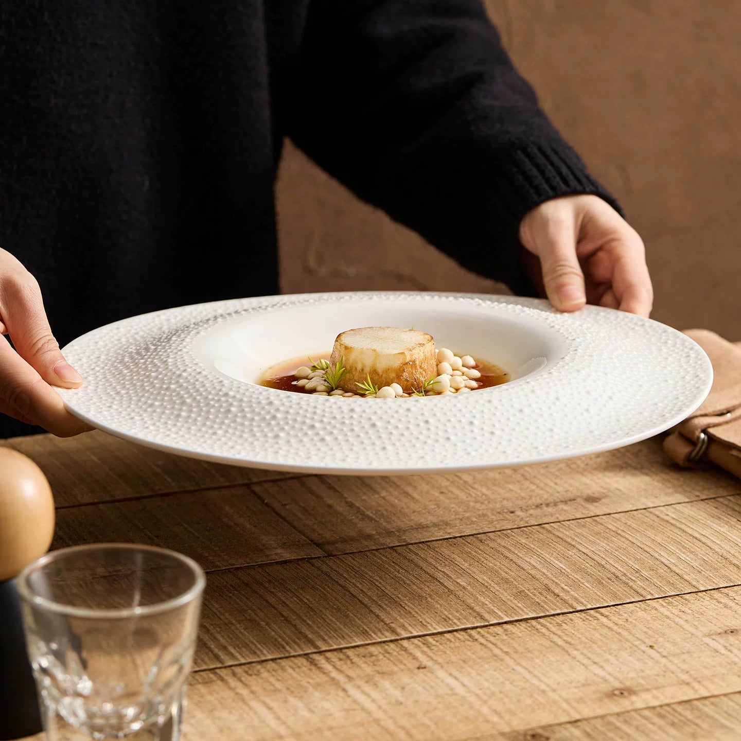 Architectural round well plate for professional fine dining plating.