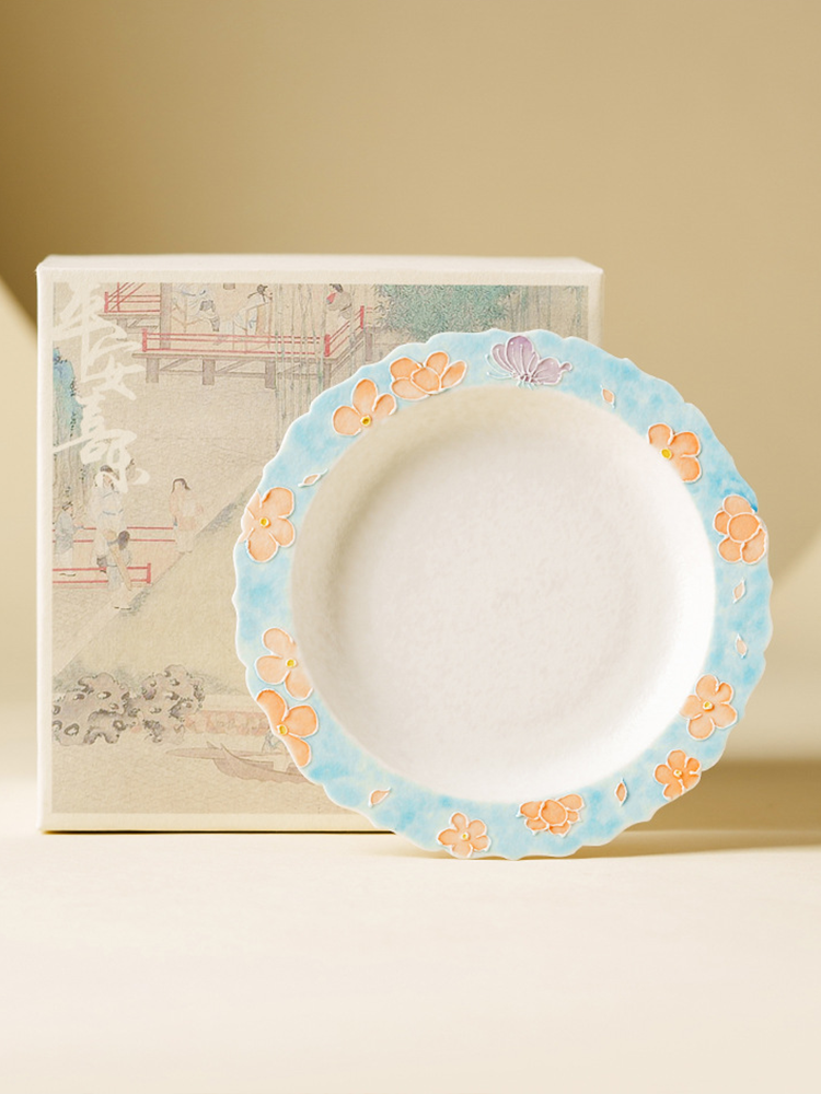 Art-inspired ceramic plate with embossed floral border