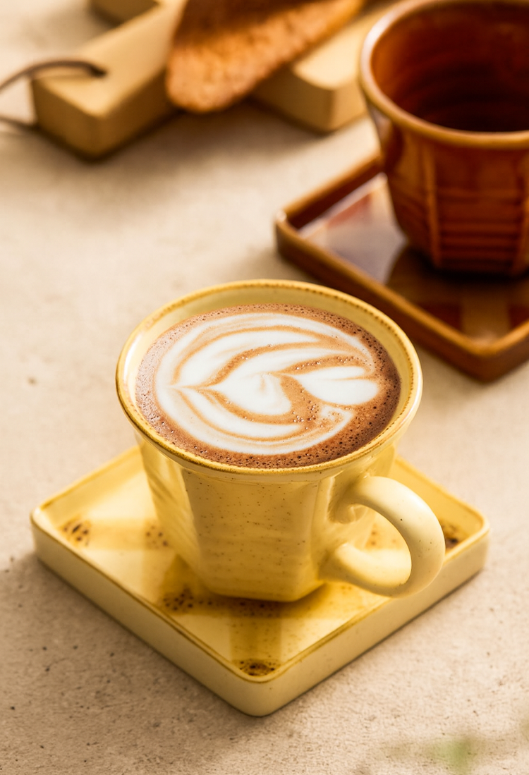 Artisan-crafted coffee mug and saucer with hand-painted finish