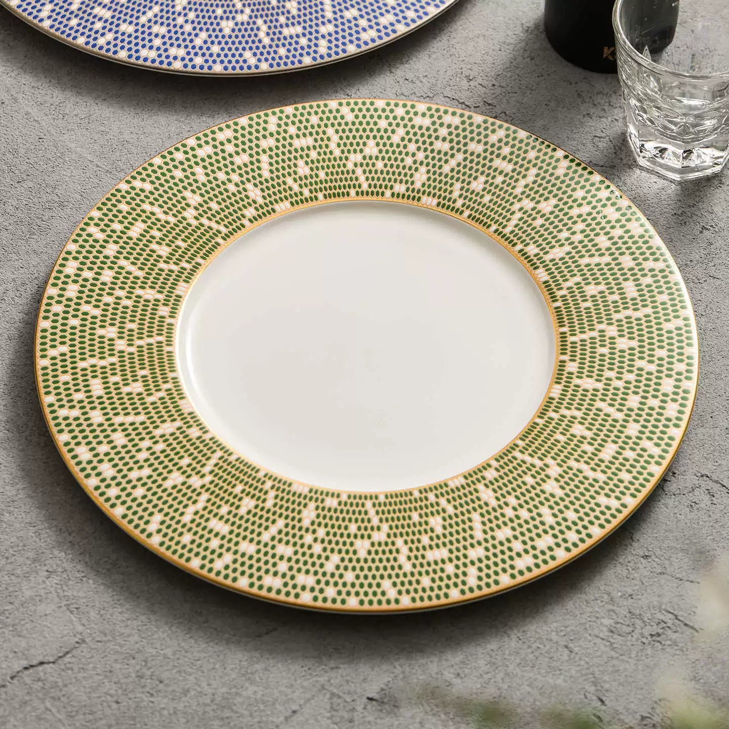 Artisan "Golden Green" mosaic plate featuring a detailed geometric tile design.