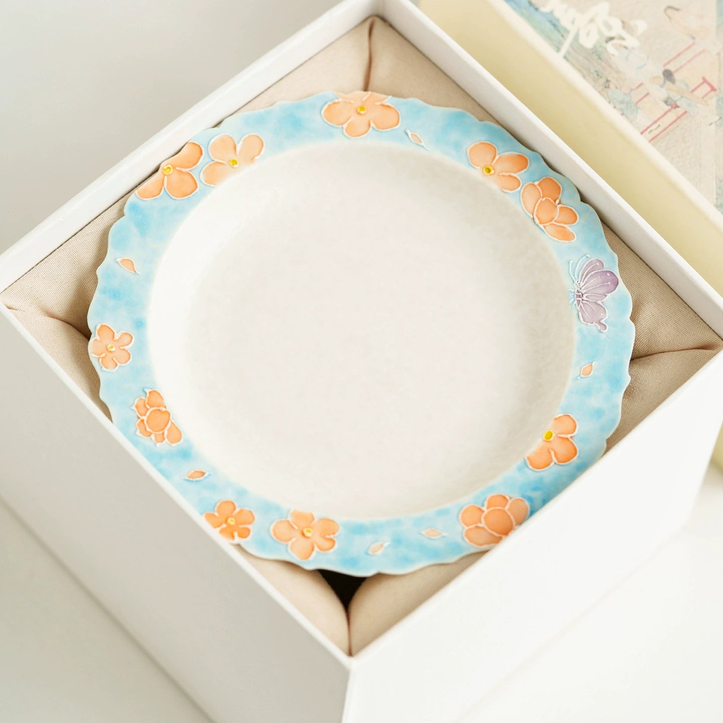 Artisanal ceramic plate with hand-painted details
