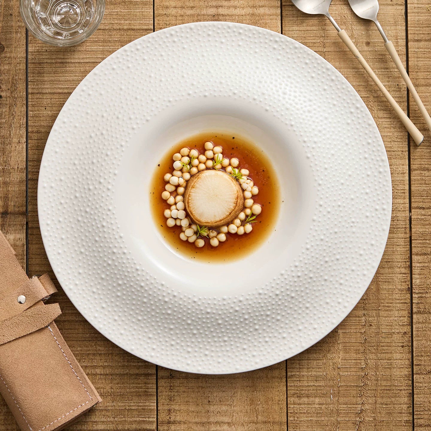 Artisanal matte white presentation plate with 993g weighted feel.