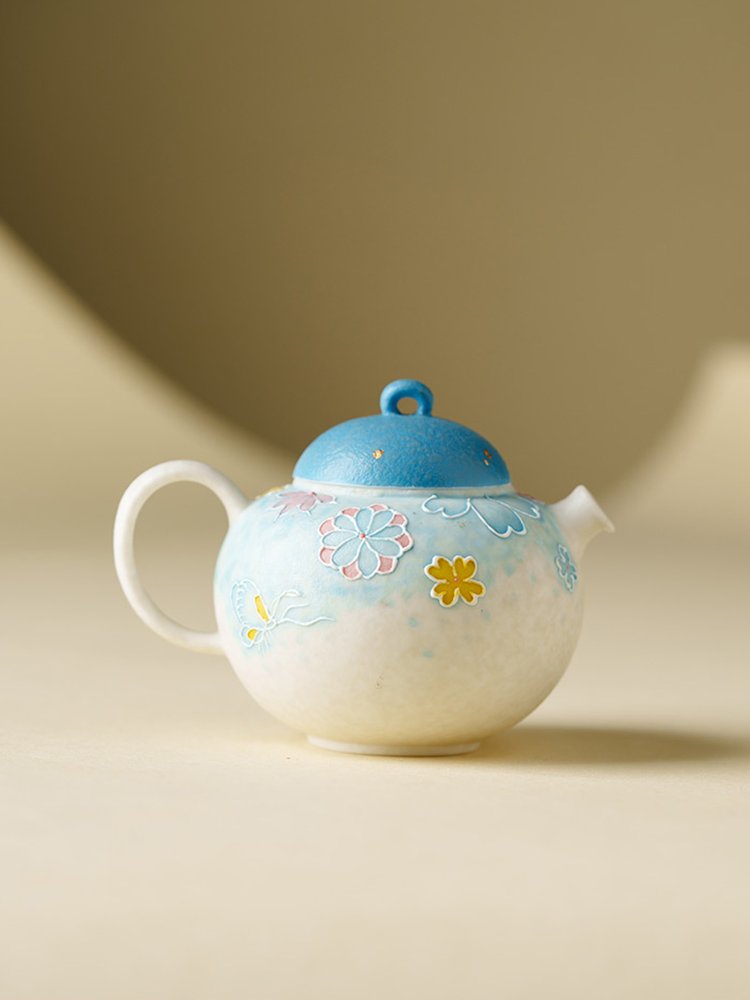Artistic ceramic teapot with flower patterns
