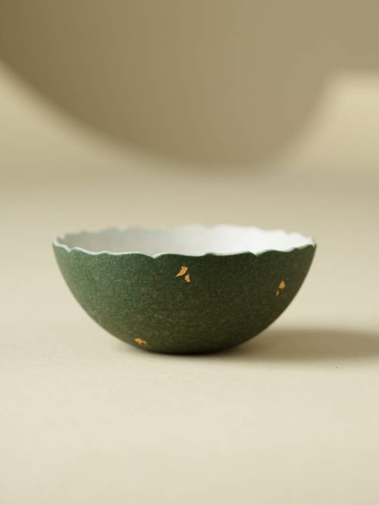 Artistic handmade green ceramic teacup