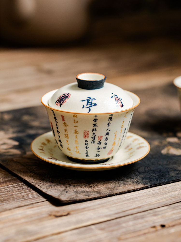 Artistic porcelain gaiwan with red seal design