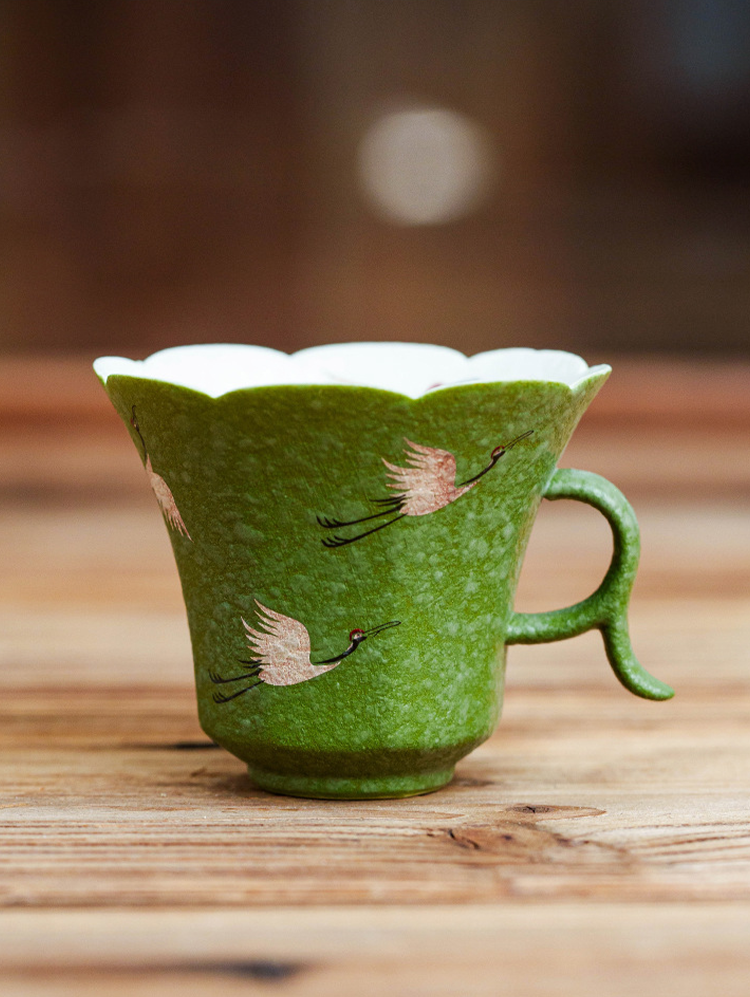 Artistic porcelain teacup with floral rim and elegant silhouette by GOSEUNG