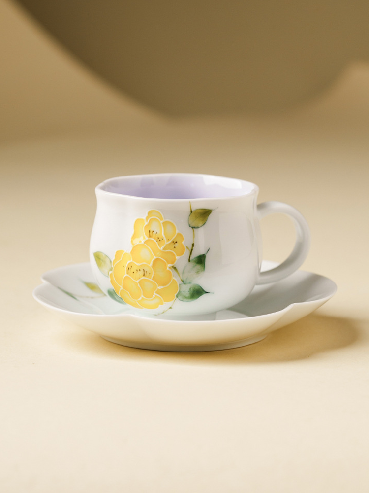 Artistic porcelain teacup with yellow peony relief pattern
