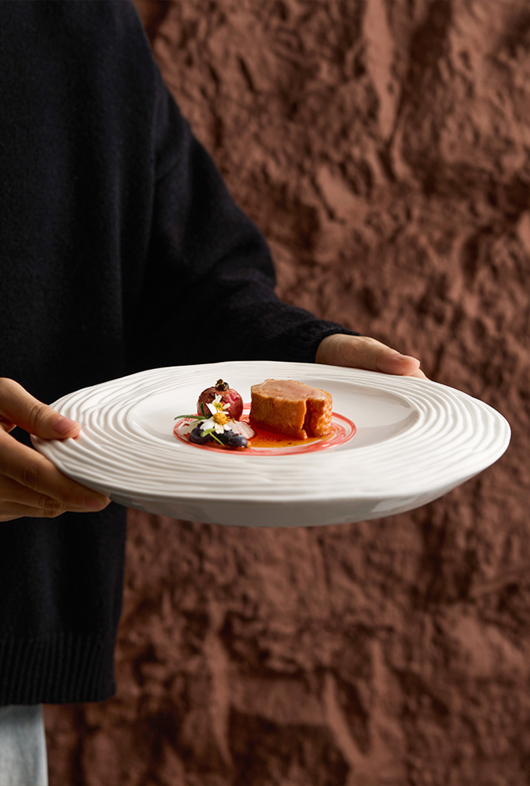 Artistic white porcelain flat plate with subtle lines