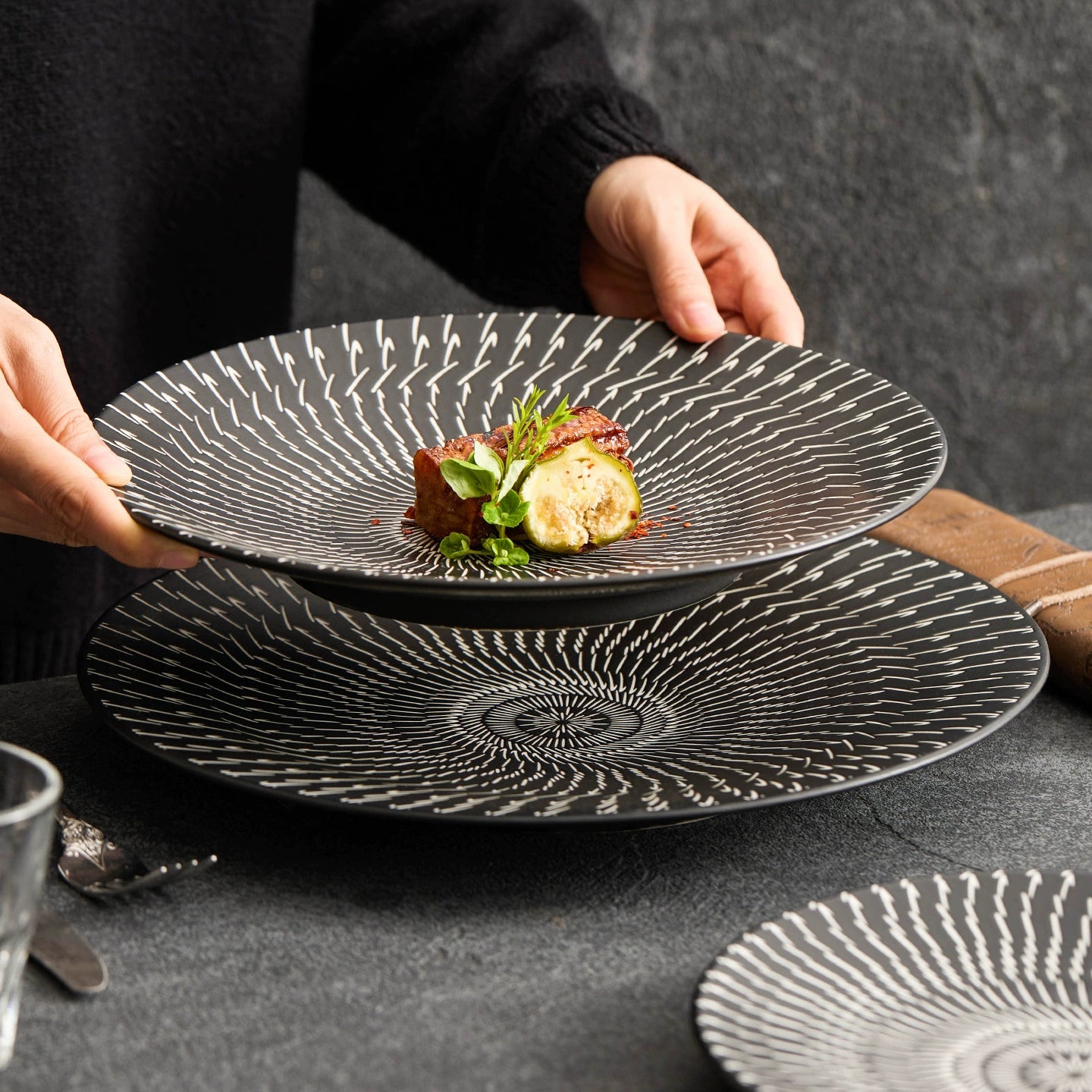 Black and white porcelain dinnerware with hand-drawn texture