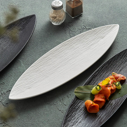 Black leaf-shaped ceramic plate with natural texture

