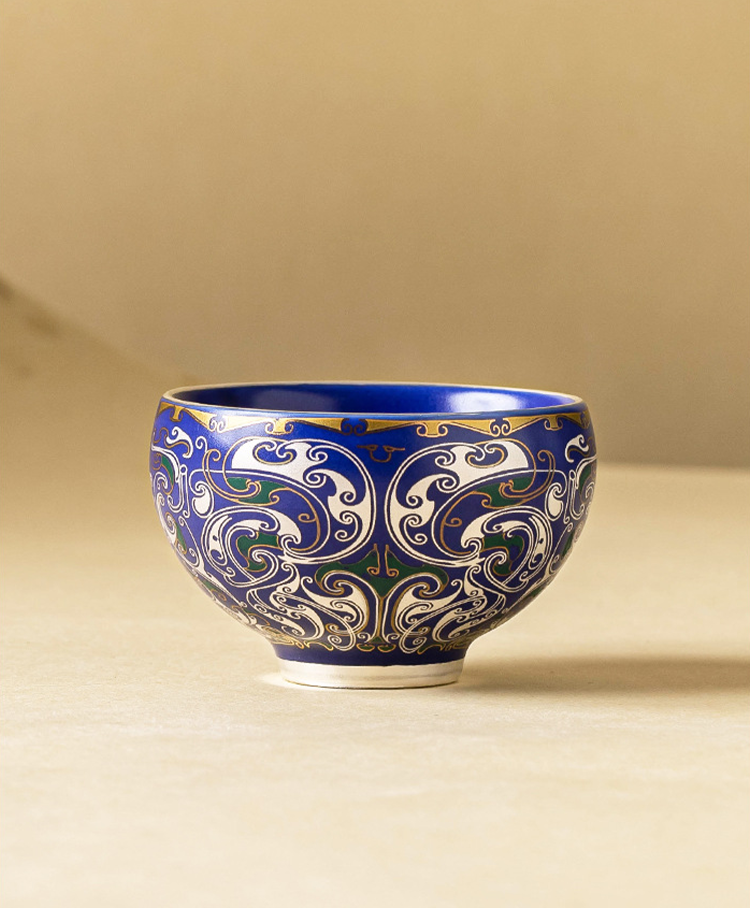 Blue glazed porcelain master cup with dragon-inspired filigree