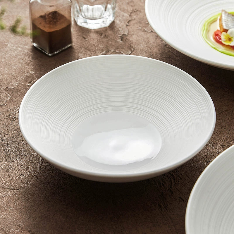 Ceramic bowl with ripple engraving for elegant dining