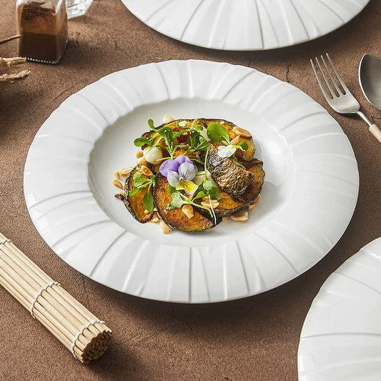 Ceramic dinner plate with origami-inspired radiating rim design