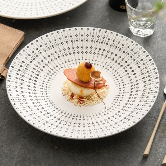 Ceramic dinner plate with radial heart pattern

