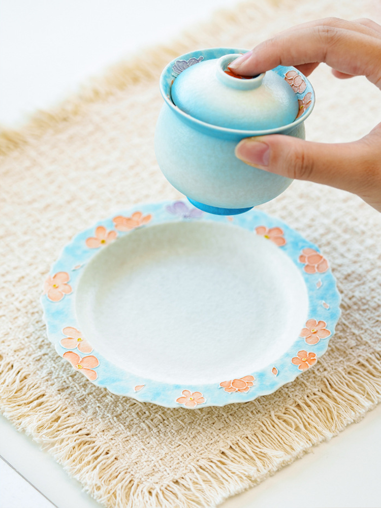 Ceramic dish with hand-painted floral motifs