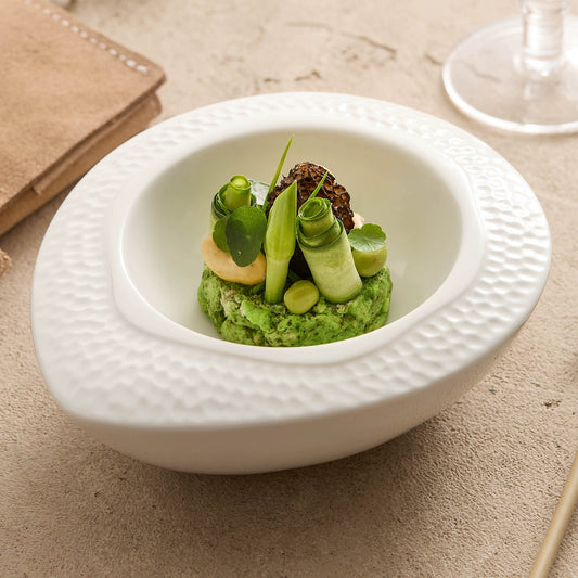 Ceramic hammered oval bowl with double-layer design for fine dining