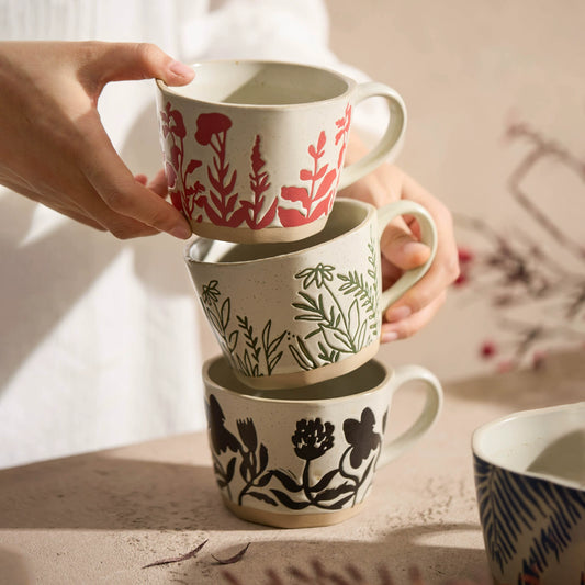 Ceramic mug featuring natural leaf and grass patterns