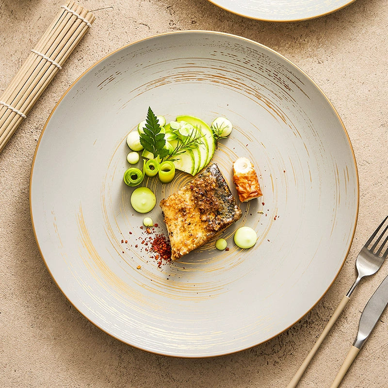Ceramic plate with golden accents for main courses

