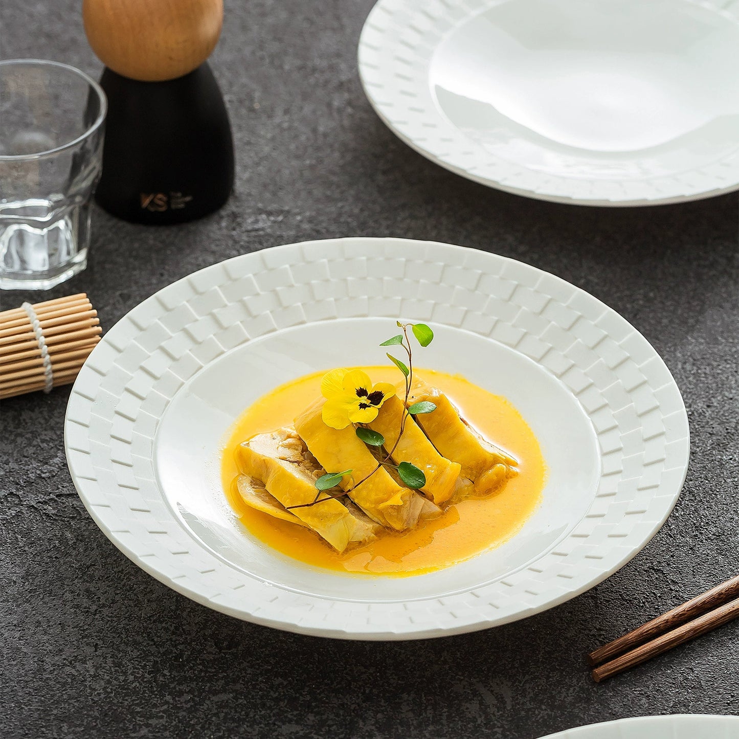 Ceramic shallow plate designed for elegant food presentation