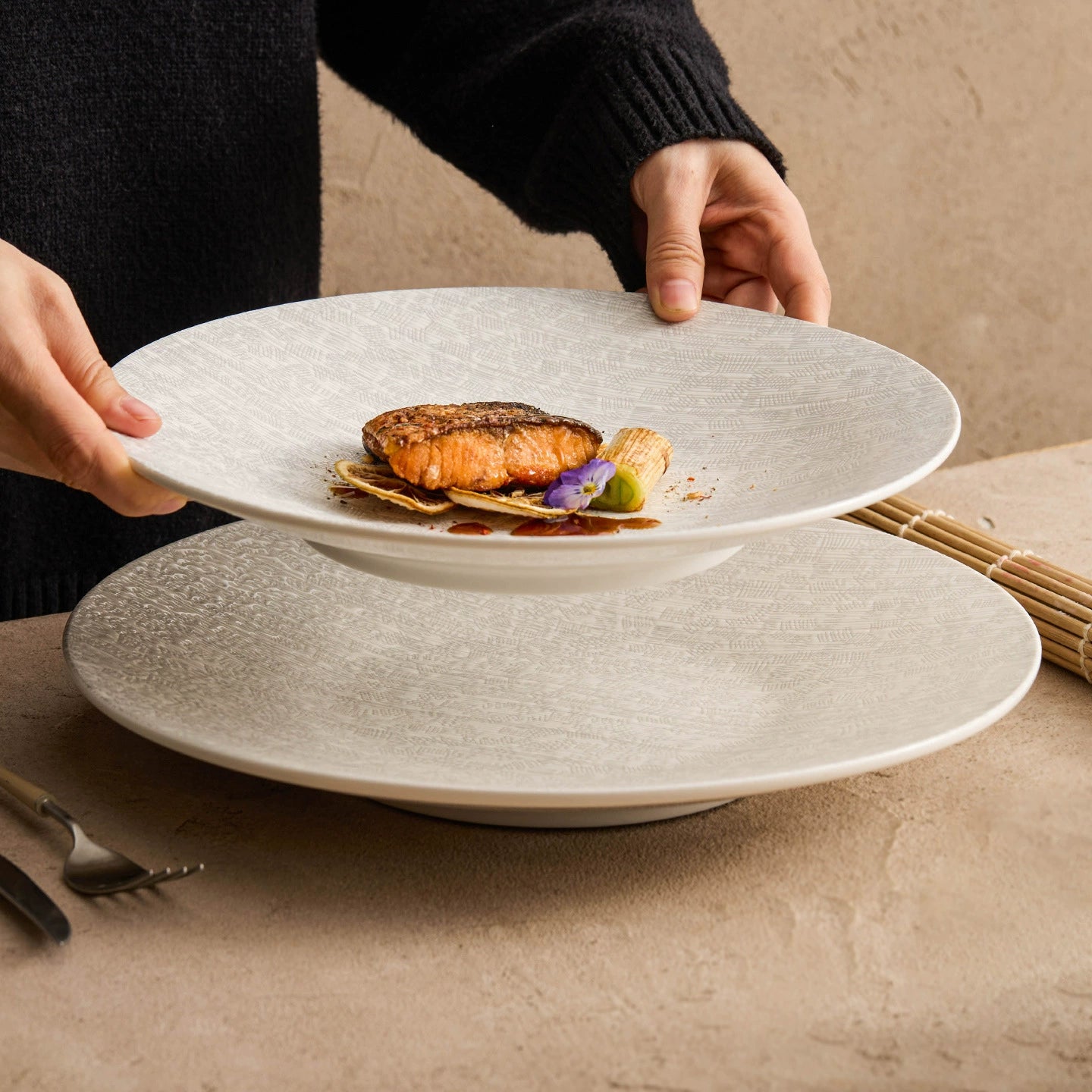 Ceramic shallow presentation plate used for refined culinary styling