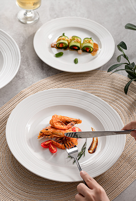 Ceramic shallow presentation plate with layered rim detail