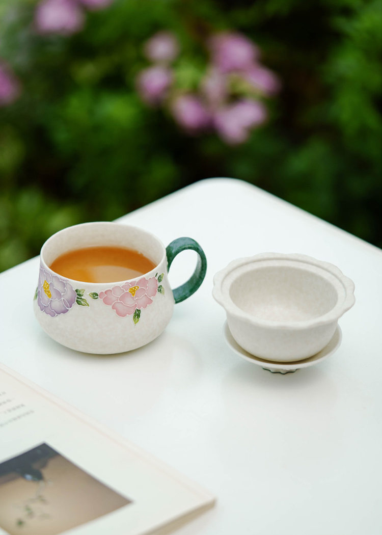 Ceramic tea cup with botanical hand-painted pattern