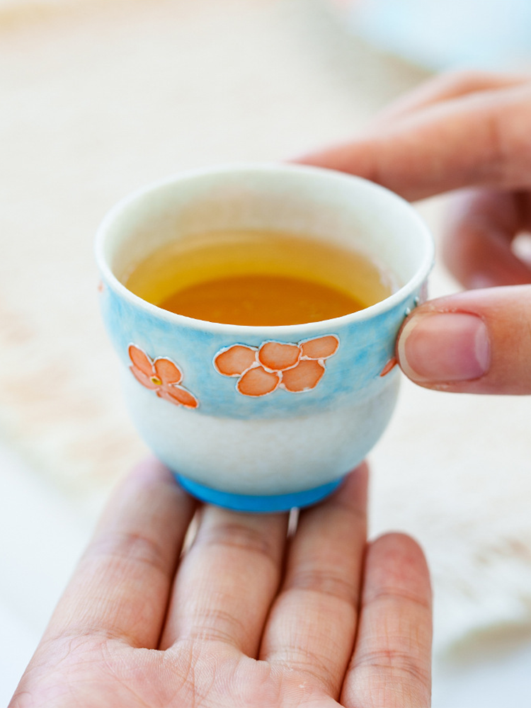 Ceramic tea cup with symbolic rounded silhouette