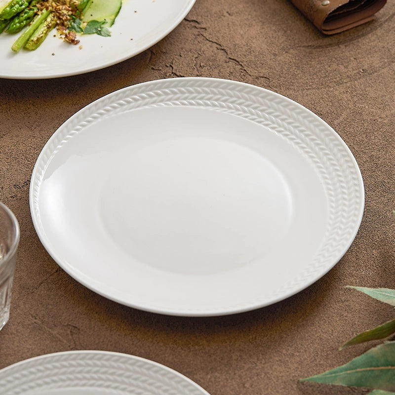 Classic white ceramic plate with braided relief design