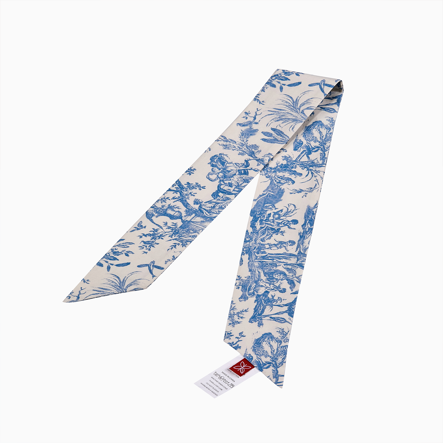 Close-up of a model wearing the Pink Toile de Jouy twilly tied elegantly as a neck scarf.