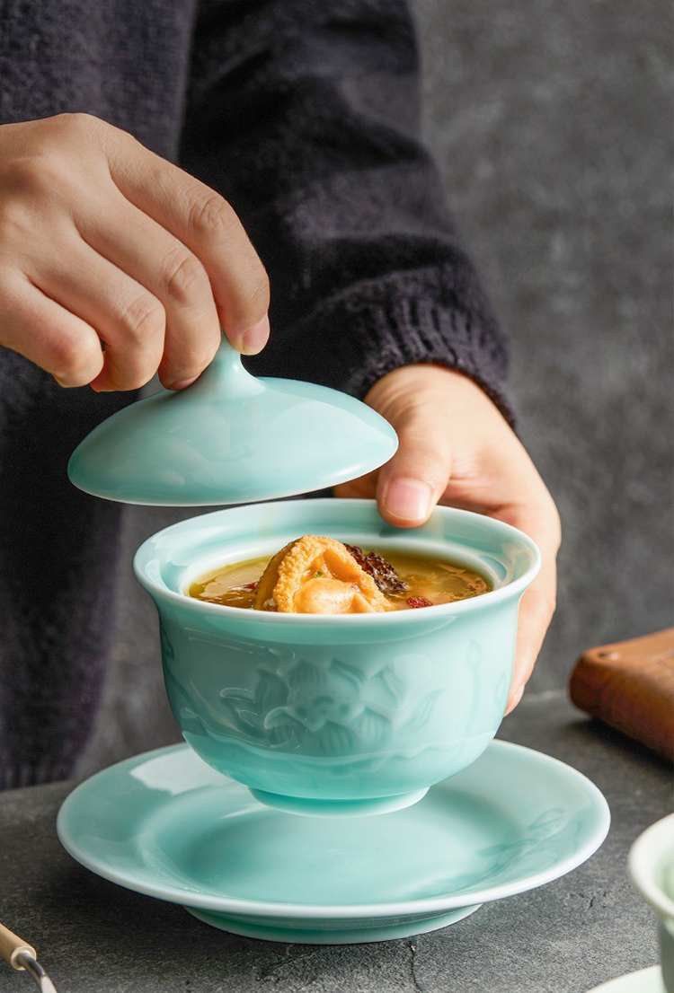 Close-up of lotus carving on porcelain wellness soup pot
