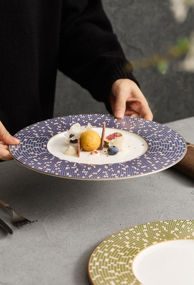 Close-up of the intricate geometric mosaic texture on a high-fired ceramic rim.