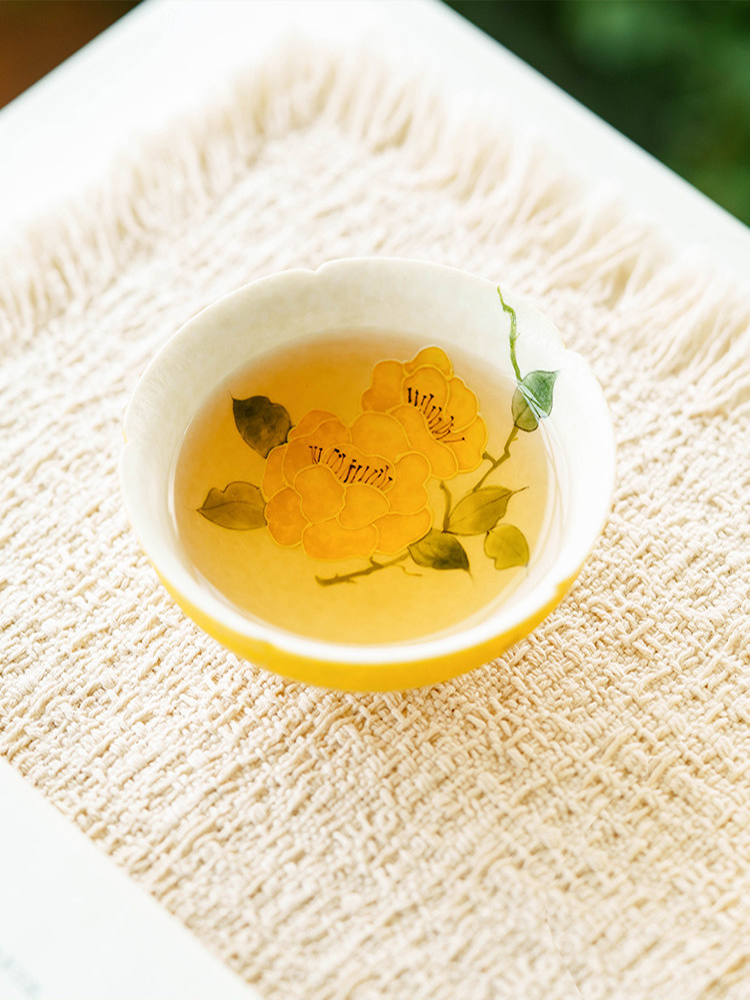 Conical porcelain cup with a 9cm diameter mouth and 2.8cm base.