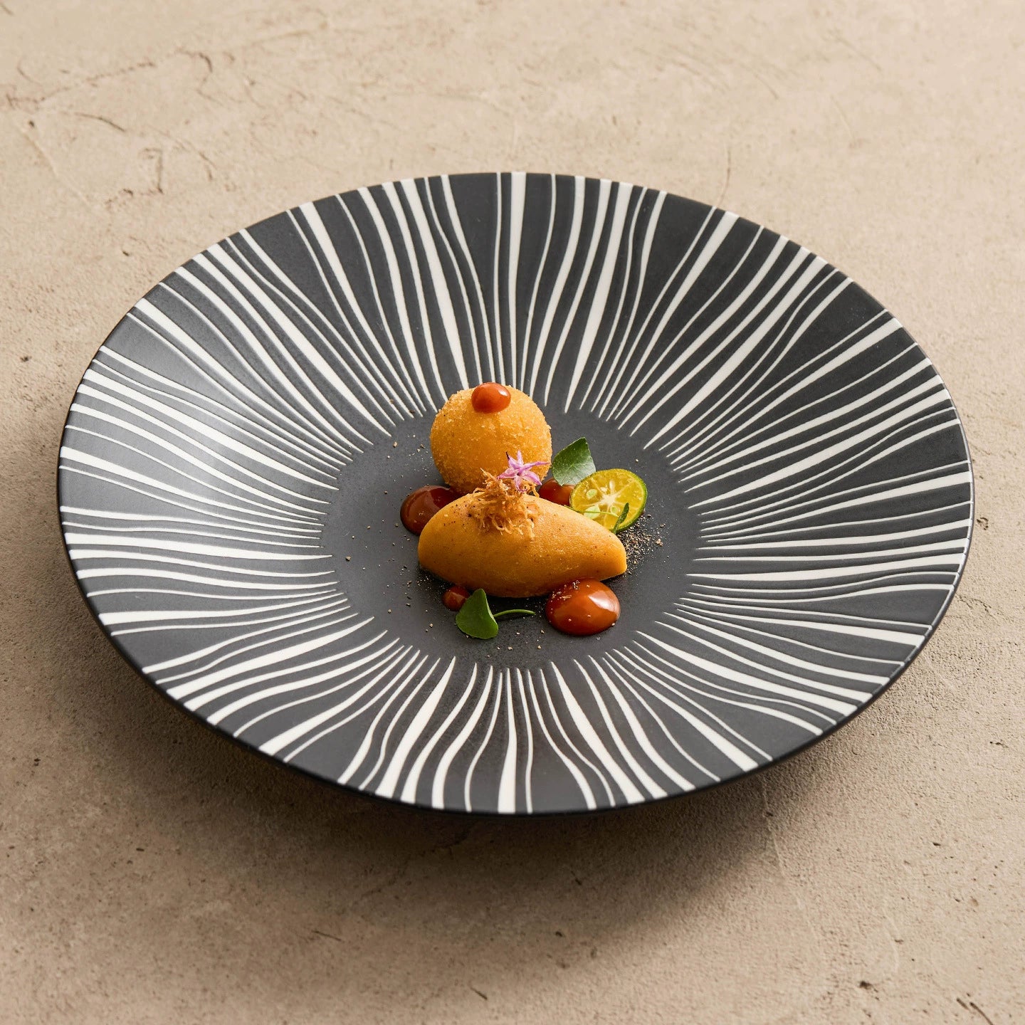 Contemporary dinner plate with starburst-inspired design

