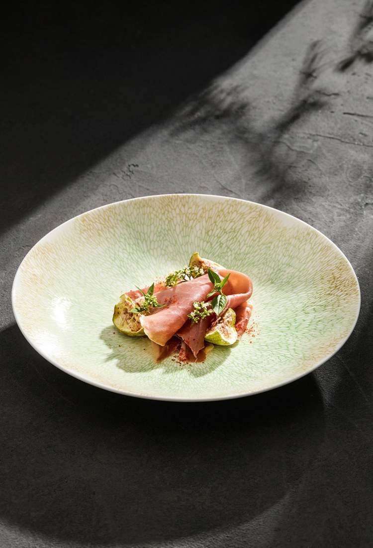 Contemporary plating bowl with ripple-inspired surface