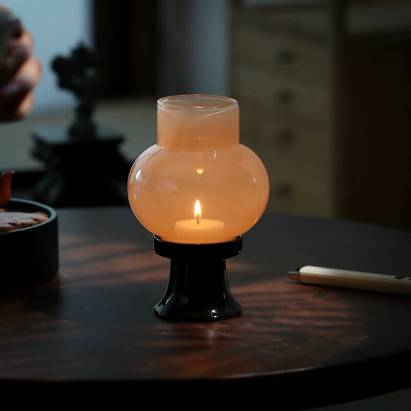 Contemporary reinterpretation of vintage oil lamp in translucent glass.