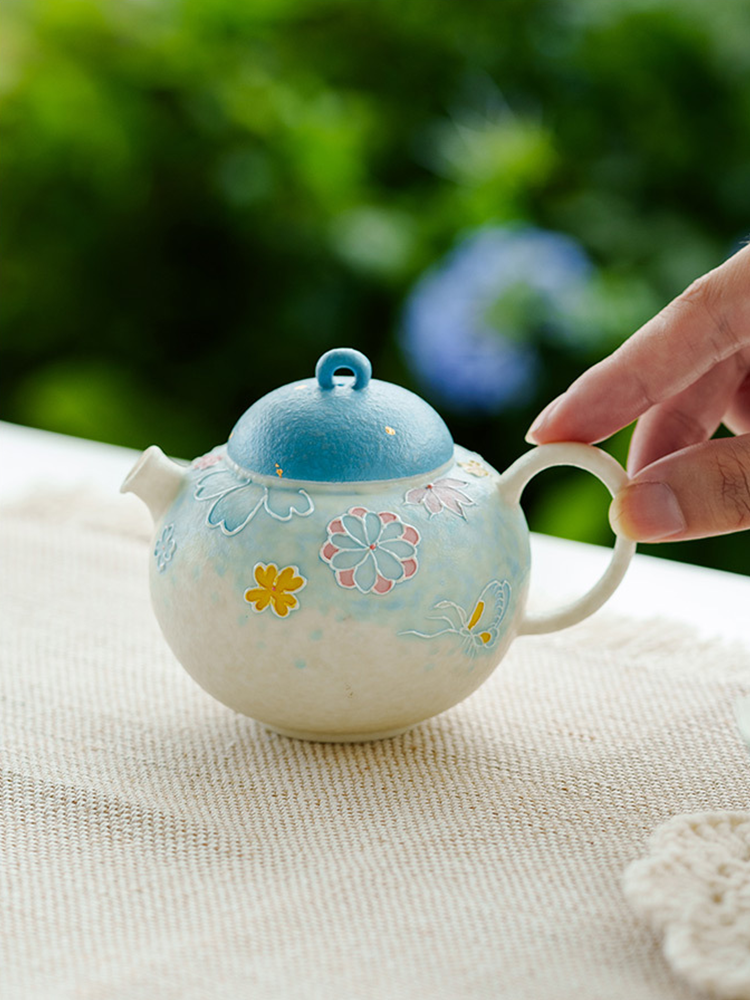 Decorative ceramic teapot with handle