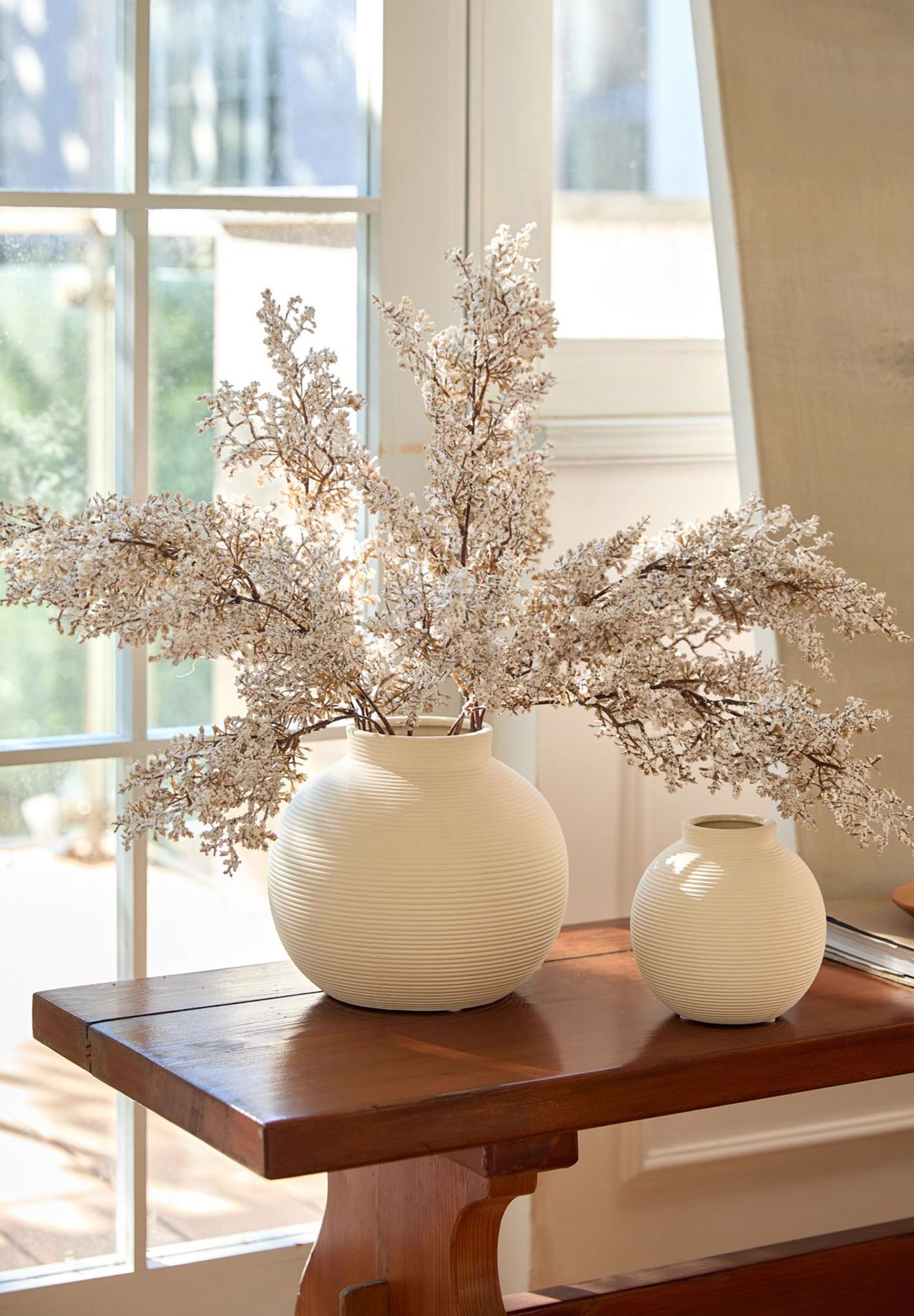 Decorative round ceramic vase on table