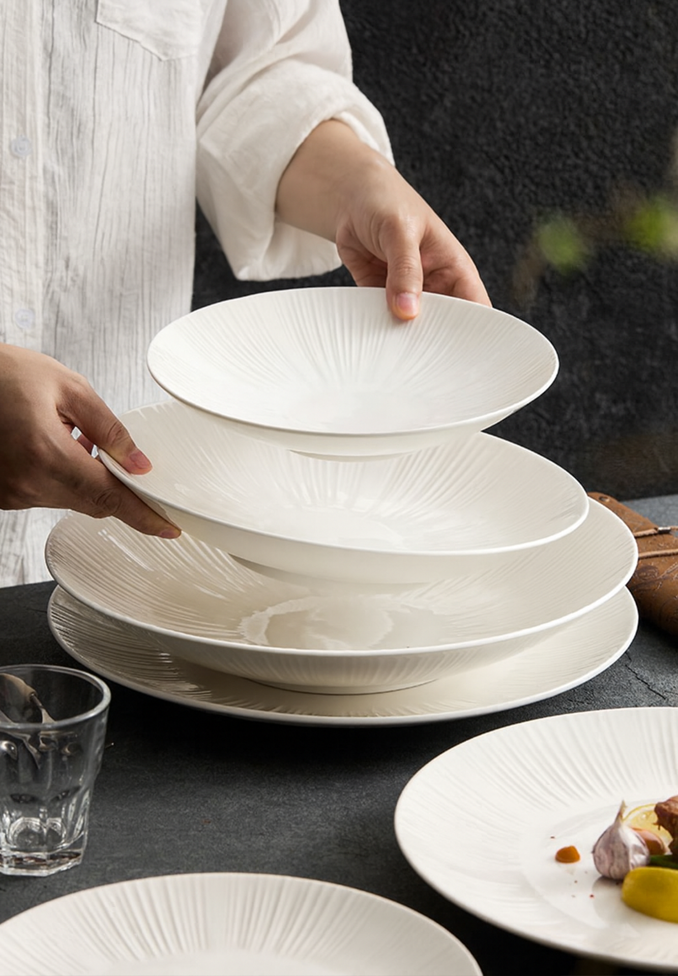 Deep sunray-embossed plate ideal for pasta, salad, or main courses.