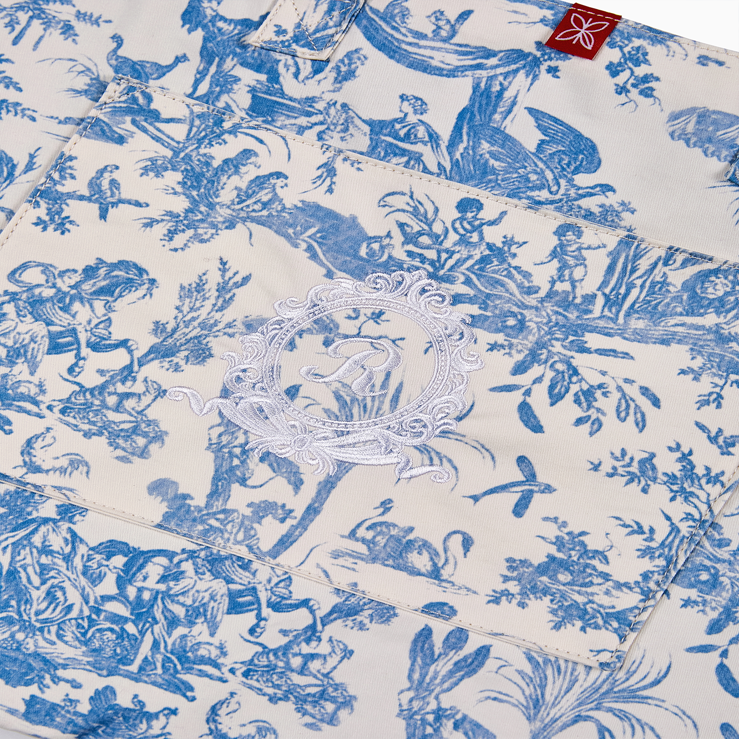 Durable 190gsm cotton tote bag in blue Toile de Jouy, combining modern utility with French heritage.