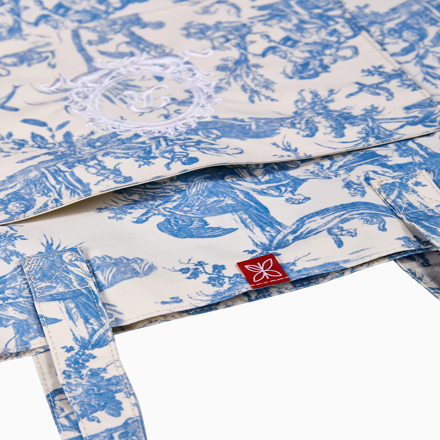 Durable 190gsm cotton tote bag in blue Toile de Jouy, combining modern utility with French heritage.