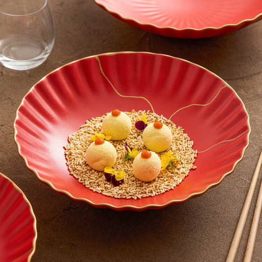 Red plate with dessert on a brown surface