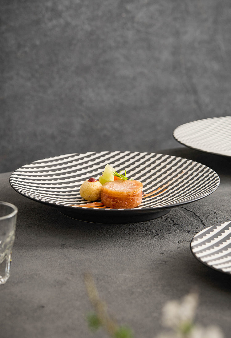 Dessert on a textured black plate with a gray background