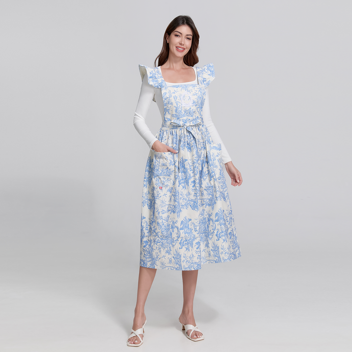 Elegant blue French-style apron ideal for hosting tea parties or garden brunches.