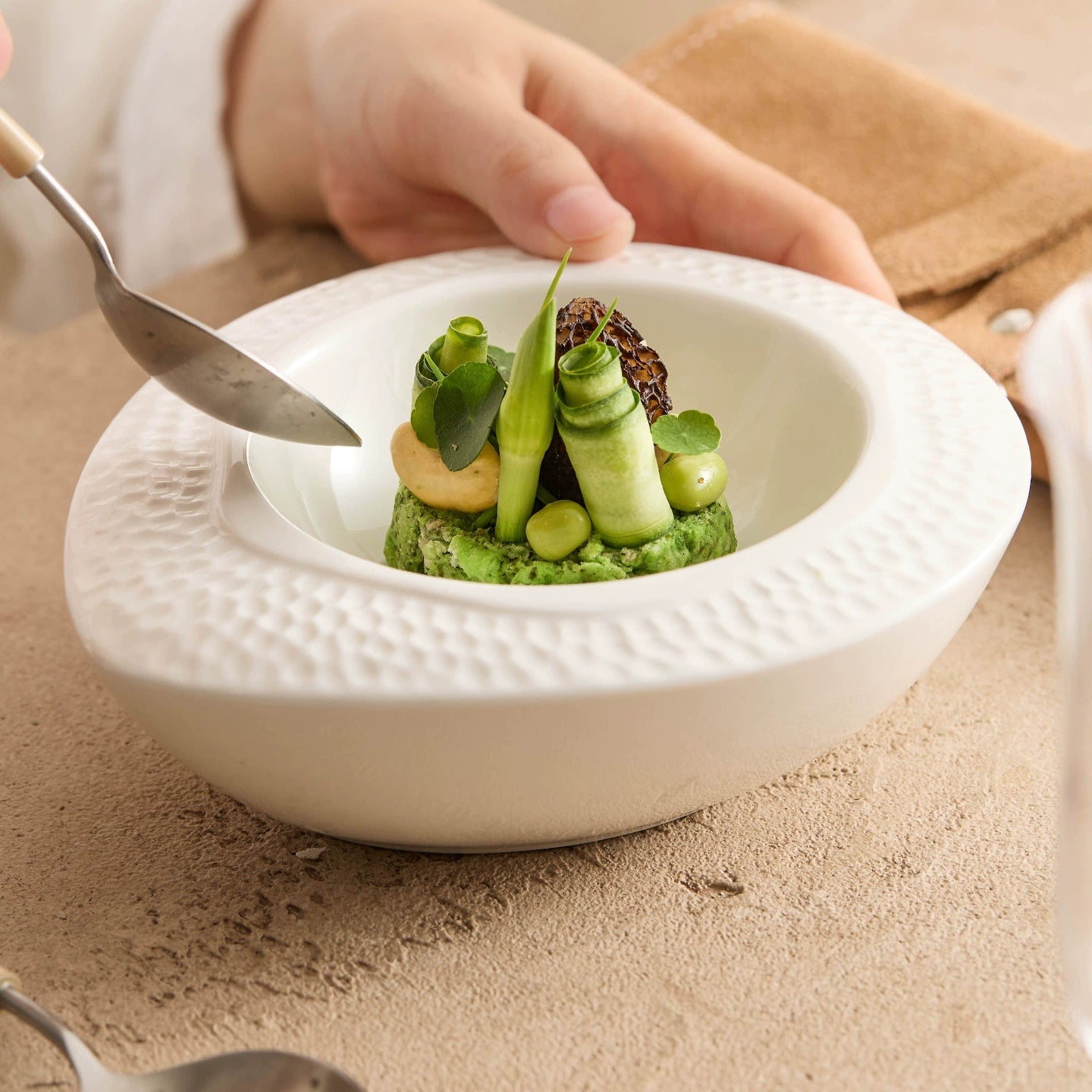 Elegant ceramic oval dish with sculptural texture