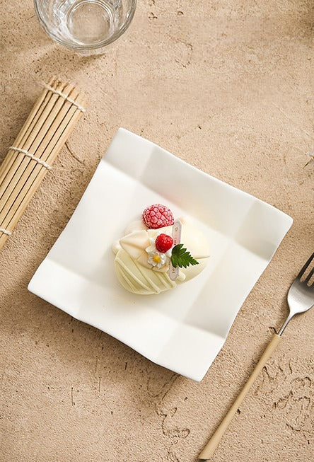 Elegant ceramic snack plate with curved corner design