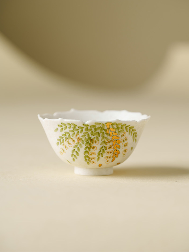 Elegant ceramic tea cup with natural leaf painting