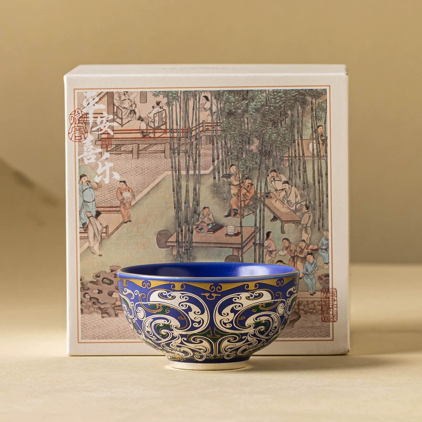 Elegant cobalt blue tea cup featuring silver scrollwork and dragon motif
