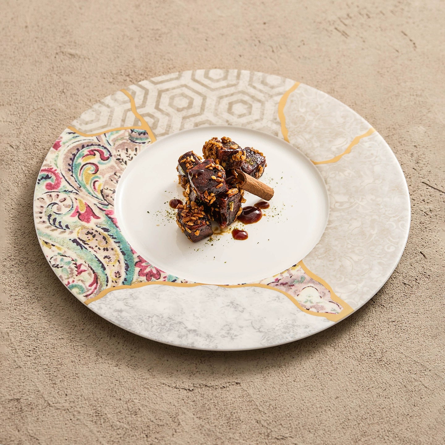 Elegant gold-lined mosaic dinner plate with textured porcelain surface