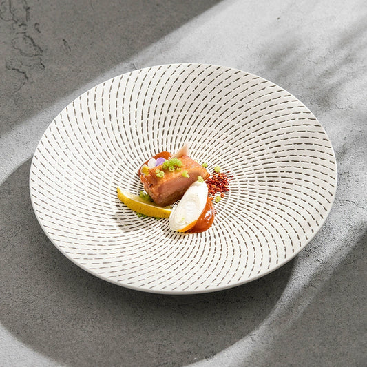 Elegant pasta plate with radial dotted line design

