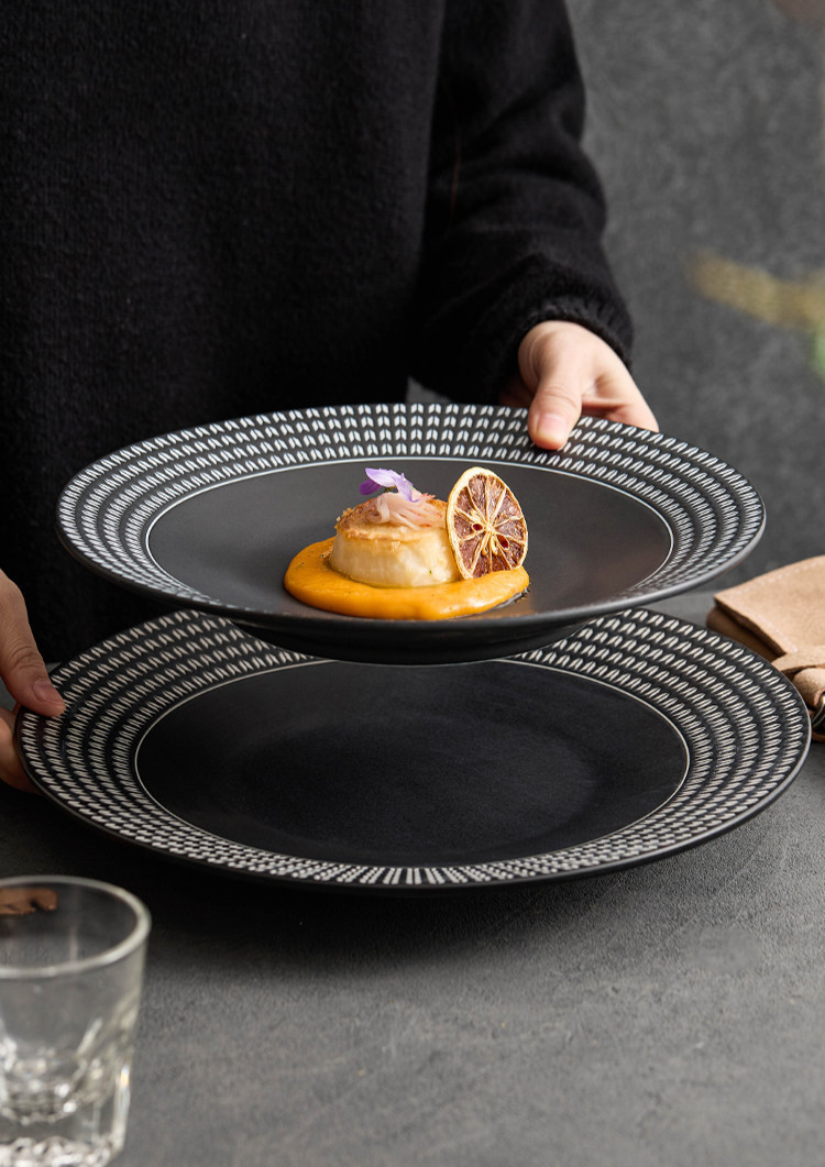 Elegant table setting featuring a wide-rimmed ceramic pasta dish from the GOSEUNG Tableware Collection.